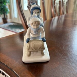 Porcelain Figurine of Children on Sled